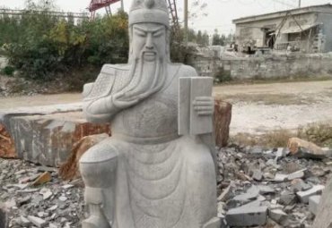 商业街看书关公石雕
