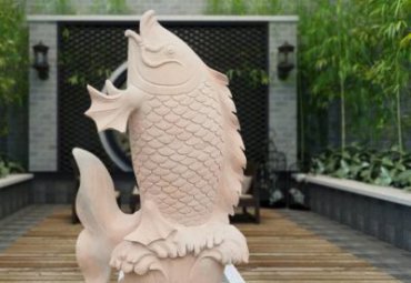景区晚霞红鱼动物石雕
